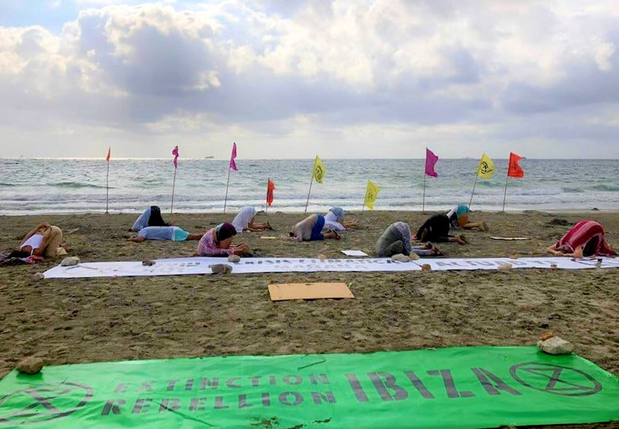 Photograph of action, rebels with their heads in the sand.