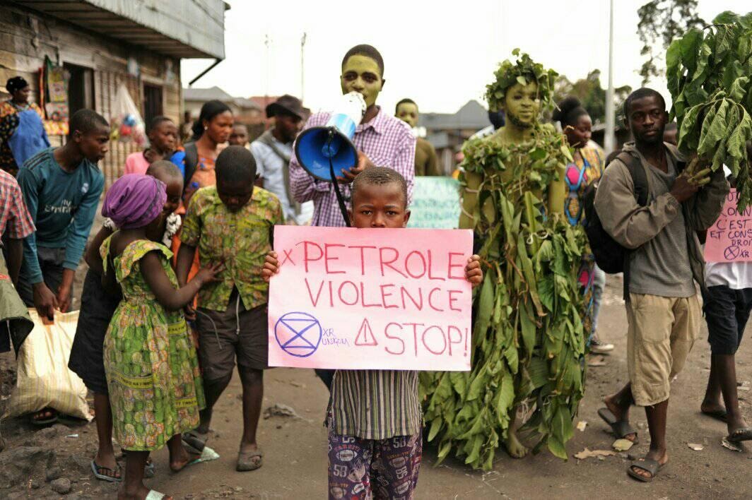 Boy holding anti-violence sign with XR logo