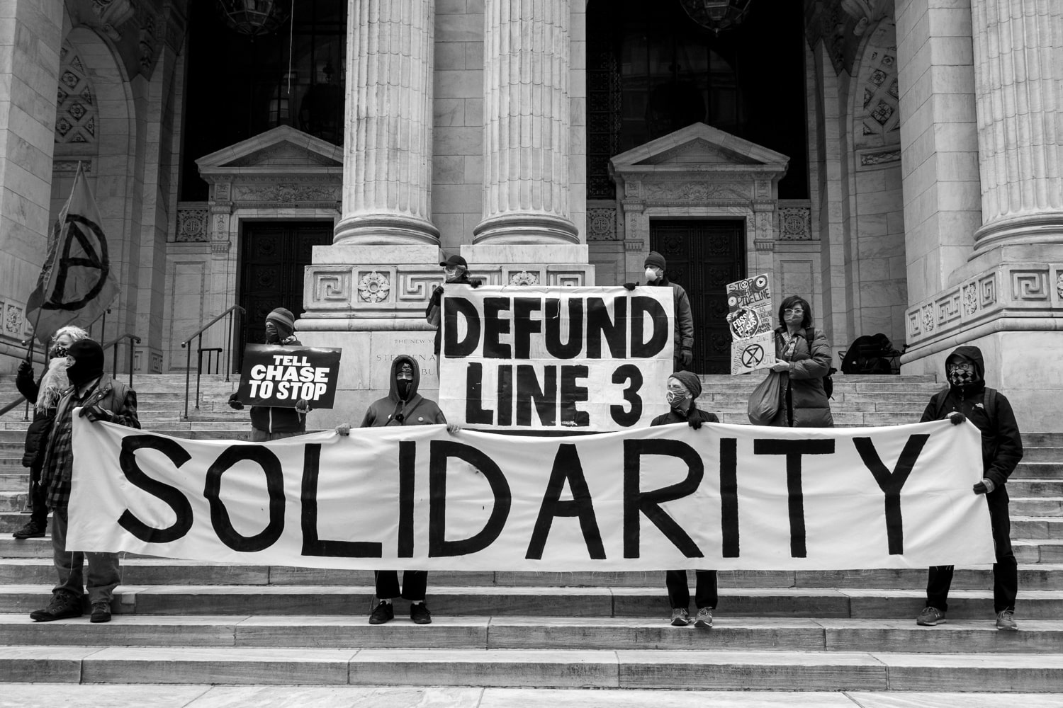 New York, USA. Rebels spray-painted and dropped banners from various dirty banks in the city, but when a rebel tragically fell from the side of a JPMorgan Chase building and broke his pelvis all further protests were cancelled.